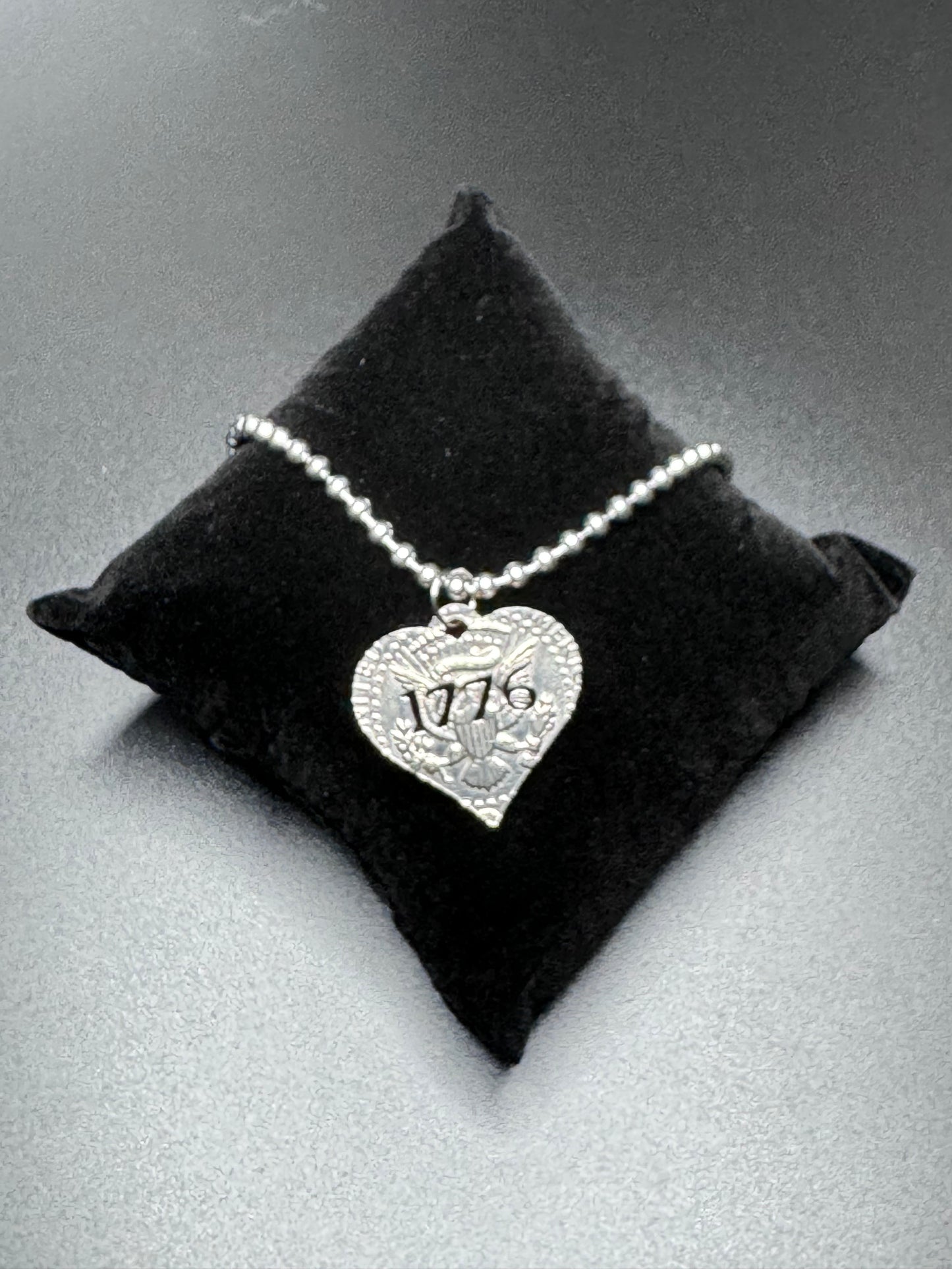 1776 heart US currency carved pendant on sterling silver chain