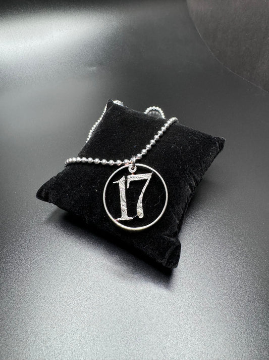 17 carved coin pendant/ sterling silver chain